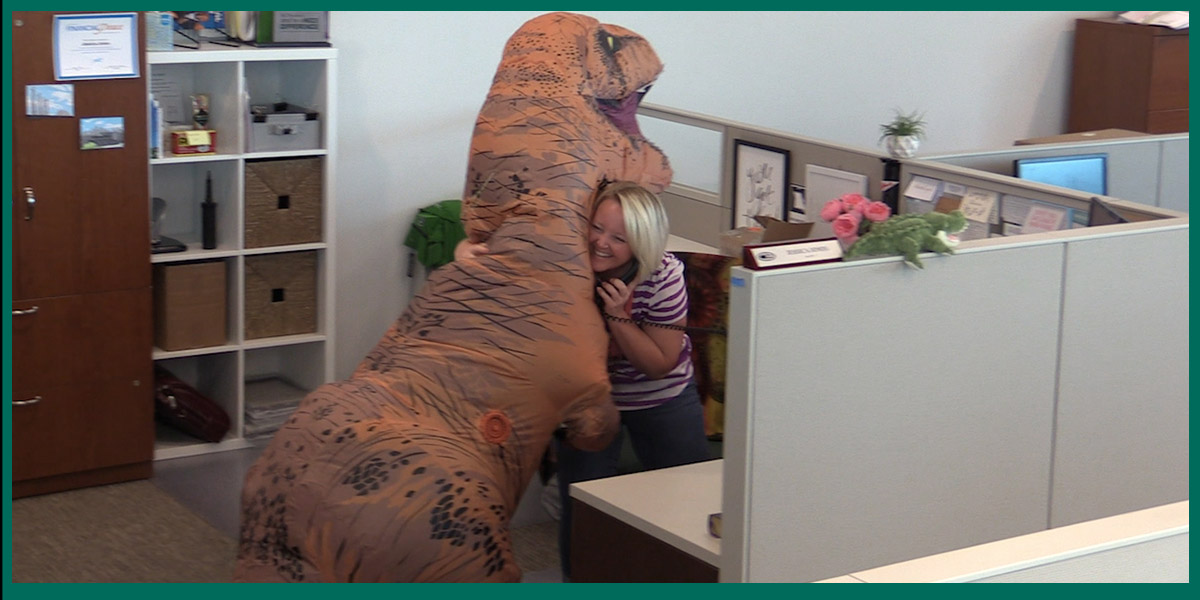 Dinosaur gives Hugs at Christian Brothers Automotive